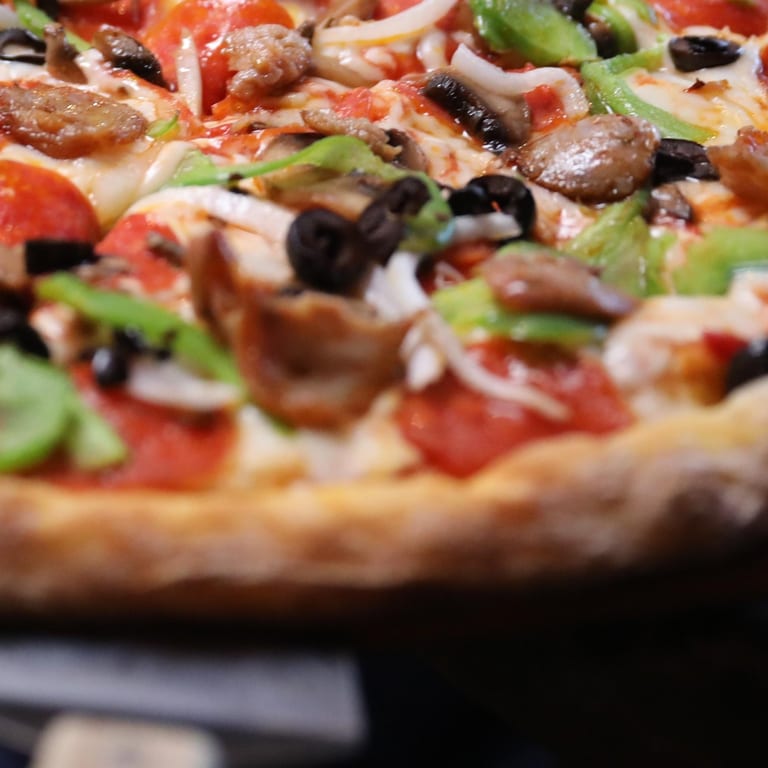 Indulge in Our Supreme Pizza